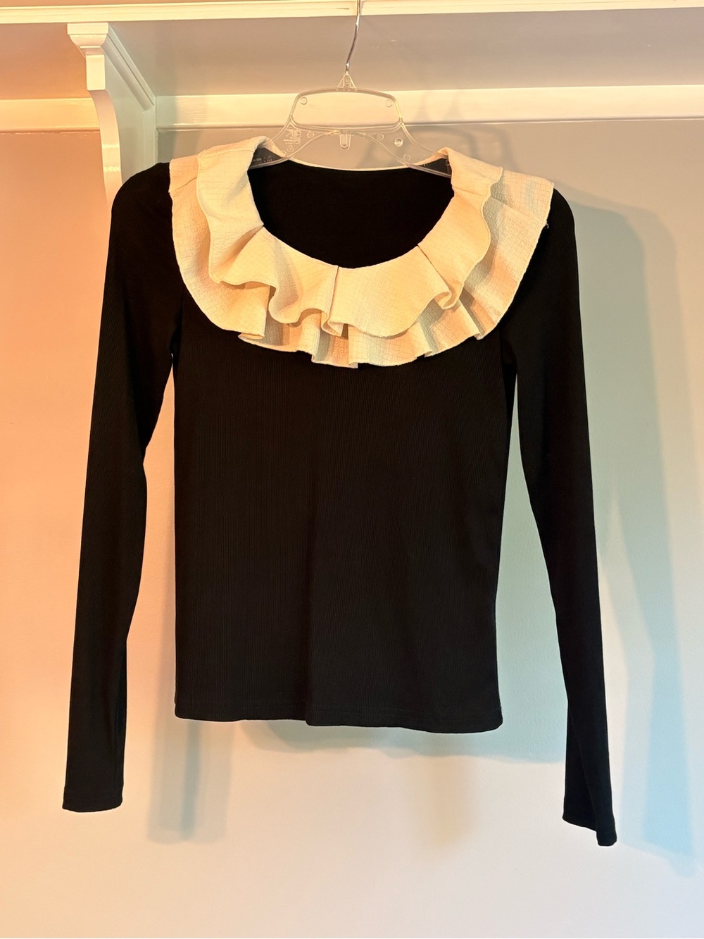 Black Long-Sleeve Blouse with Cream Ruffle Collar